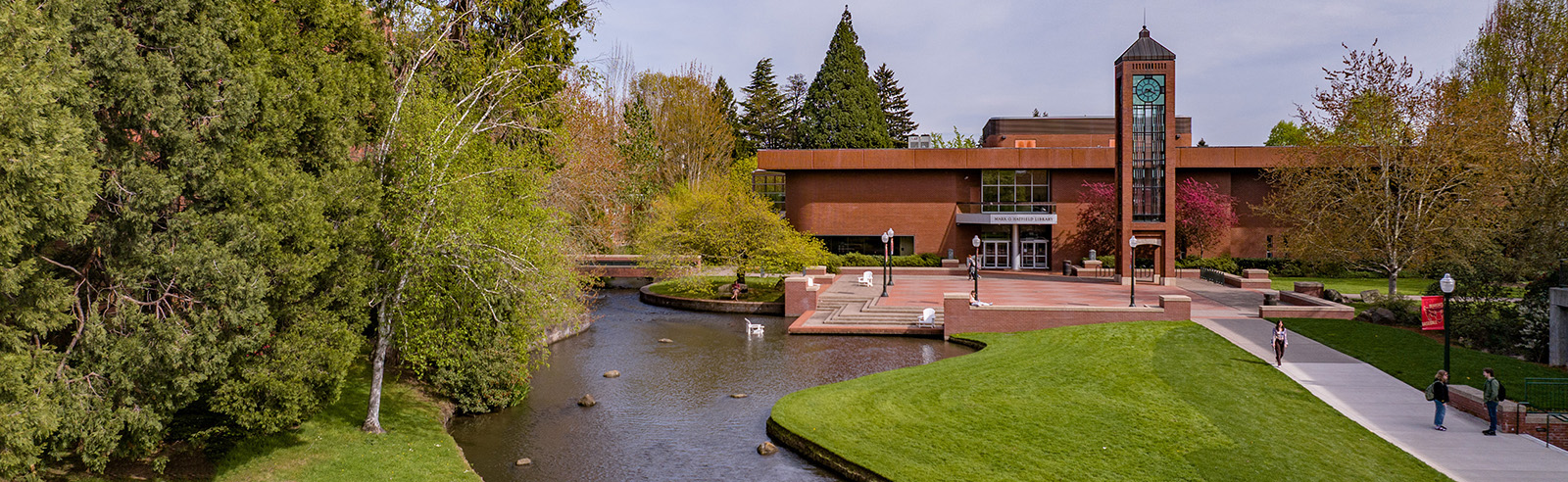 Mill Stream looking toward a two-story brick building